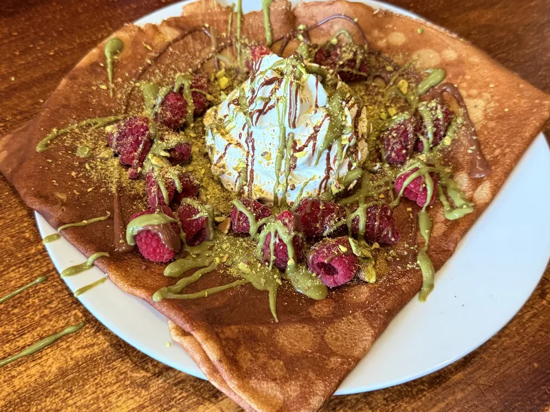 Raspberry crêpe with pistachio cream and Chantilly