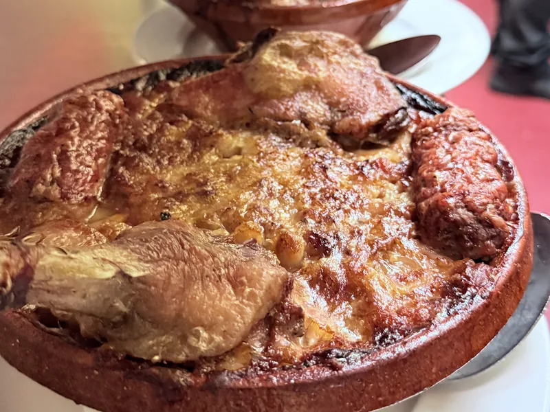 French duck confit in terracotta dishes